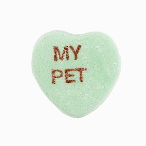 Green candy heart that reads my pet against white background.