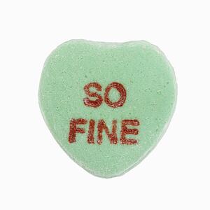 Green candy heart that reads so fine against white background.