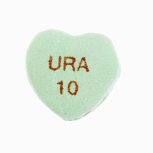 Green candy heart that reads URA 10 against white background.