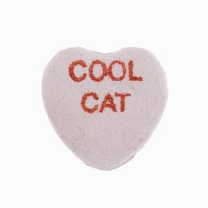 Purple candy heart that reads cool cat against white background.