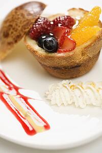 Fresh fruit stuffed brioche with vanilla anglaise.