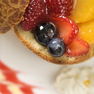 Close up of fresh fruit stuffed brioche.