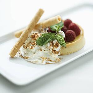 Still life of gourmet dessert with professional presentation.