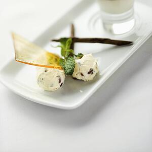 Still life of gourmet dessert with professional presentation.