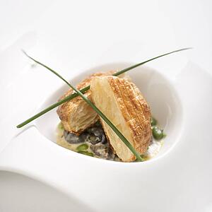 Escargot en croute with butter and fava beans.