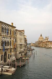 Buildings and boats on canal in Venice, Italy.