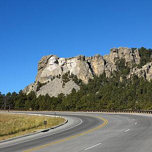 Front view of Mount Rushmore National Memorial from road.