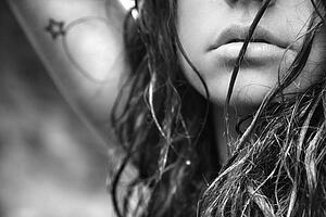 Young adult female face and disheveled hair