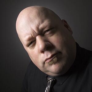 Mid adult bald man looking at viewer making confused facial expression.