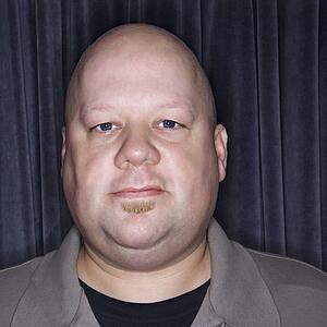 Bald man looking at viewer