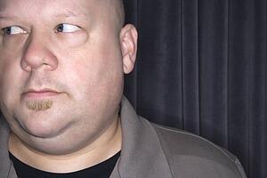 Bald man looking to side