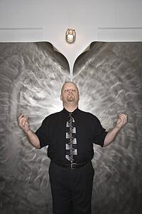 bald man in a meditative position