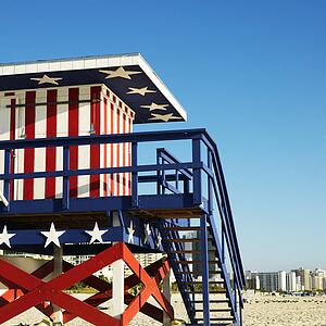 Lifeguard tower painted red, white and blue with stars and stripes on beach in Miami, Florida, USA