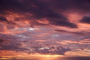 Purple glowing clouds during sunset 