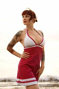 Attractive tattooed Caucasian woman on beach 