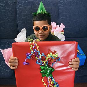 Boy wearing party hat and sunglasses 