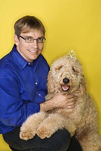 Man with Goldendoodle dog