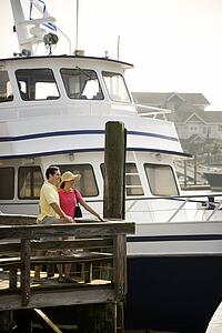 Couple at dock with boat