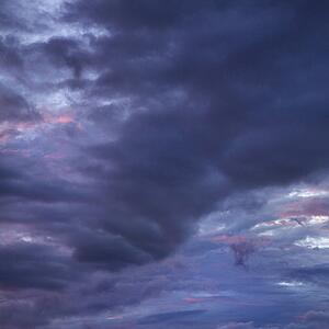 Dark ominous storm clouds spreading across sky