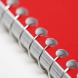 Close up red spiral bound notebook.