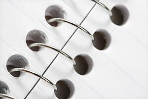 Close up of wire in spiral bound notebook
