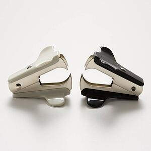 Two staple removers on white background.