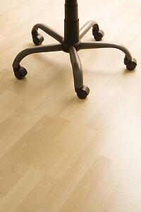 Still life of legs and wheels of office desk chair.