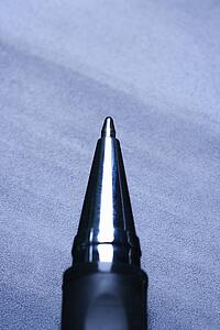 Blue tone close-up of pen tip