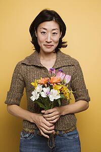 Woman holding bouquet of flowers