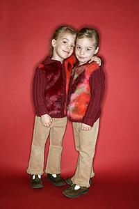 Female twins embrace