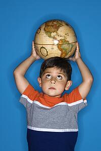 Boy holding globe on head