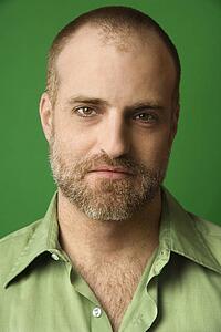 Man with receding hairline and beard 