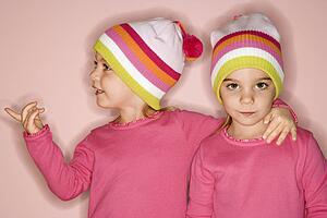 Twin children standing together