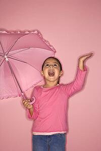 Female Hispanic girl with umbrella.
