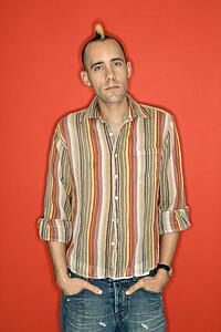 Man with mohawk standing