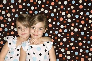 Twins looking at viewer
