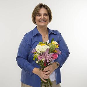 Woman holding bouquet of flowers