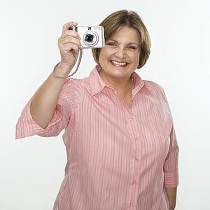 Woman taking photo with digital camera