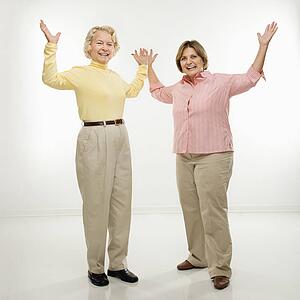 Women with arms in air
