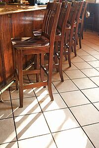 Chairs lined up at bar