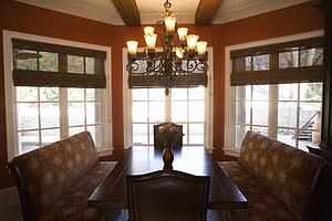 Dining room with table and chairs in affluent home.