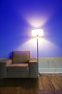 Modern chair and floor lamp with blue cast from projection
