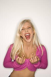 Portrait of sassy attractive blonde Caucasian young adult woman wearing fuchsia making bold hand gestures at viewer.