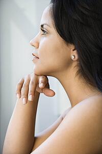 Woman with head on hand