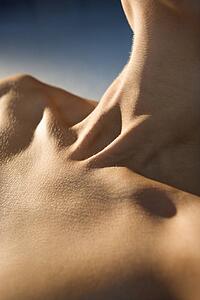 Neck and upper chest of woman.