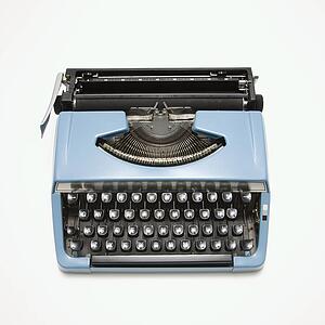 Blue vintage typewriter on white background