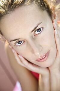 Close-up of Caucasian mid-adult woman looking at viewer.