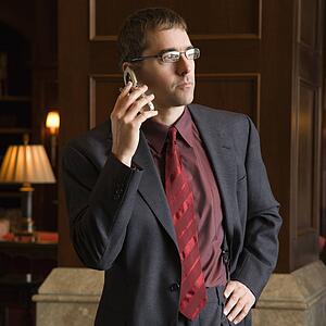 Caucasian mid adult buisinessman on cell phone.