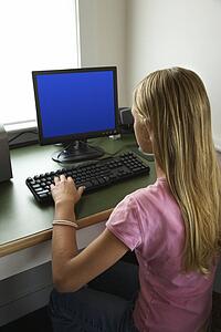 Pre-adolescent on the computer