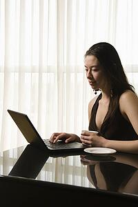Woman at a desk with a laptop